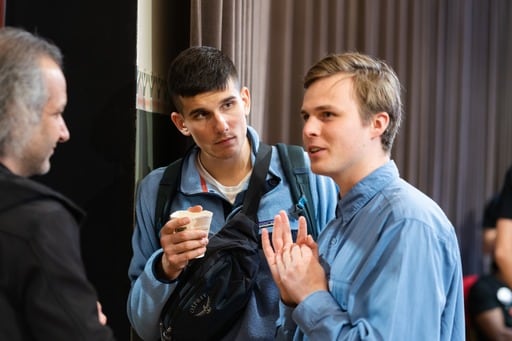 Three men talking